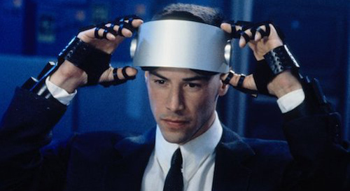 Johnny Mnemonic putting on VR headset